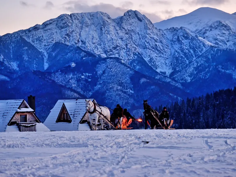 Horse-drawn sleigh ride (kulig) below Giewont in winter